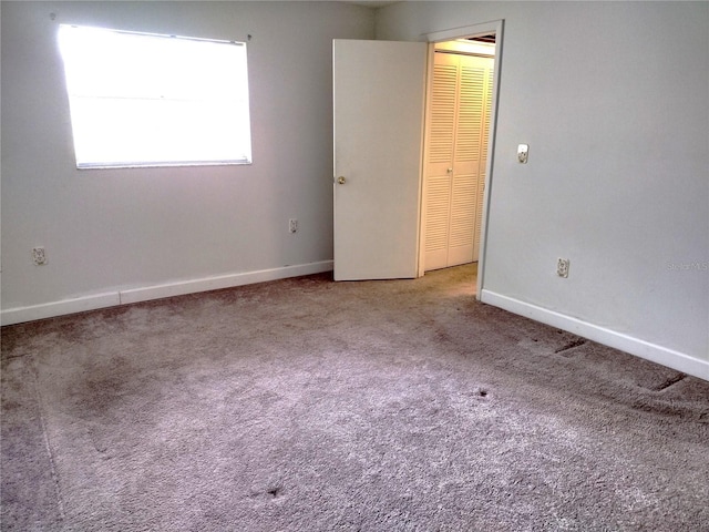 11715 Boynton Ln Unit 74B, New Port Richey, FL 34654 - empty room with carpet and baseboards