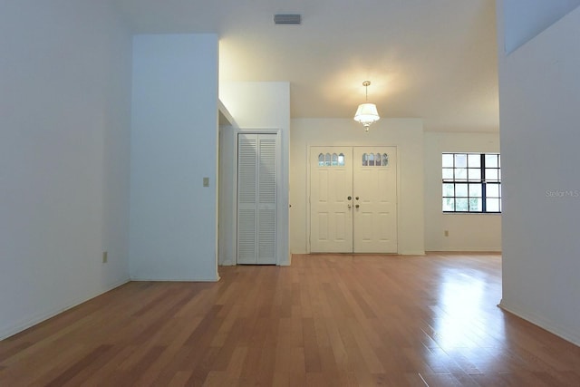 11364 Orangewood Ct, Spring Hill, FL 34609 - foyer entrance with light wood-style flooring and baseboards