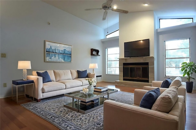 11364 Orangewood Ct, Spring Hill, FL 34609 - living room with a high end fireplace, wood finished floors, a ceiling fan, baseboards, and high vaulted ceiling