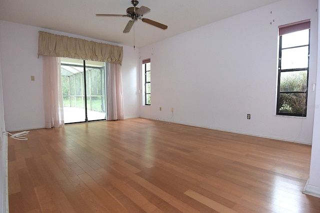 11364 Orangewood Ct, Spring Hill, FL 34609 - empty room with light wood finished floors and ceiling fan