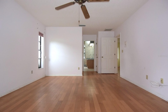 11364 Orangewood Ct, Spring Hill, FL 34609 - unfurnished room with ceiling fan, light wood-type flooring, and baseboards