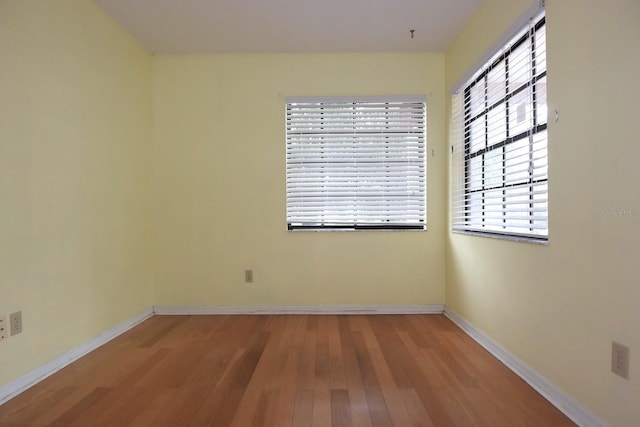 11364 Orangewood Ct, Spring Hill, FL 34609 - unfurnished room featuring wood finished floors and baseboards