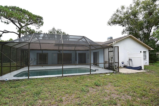 11364 Orangewood Ct, Spring Hill, FL 34609 - rear view of house featuring a yard, stucco siding, a patio area, and an outdoor pool
