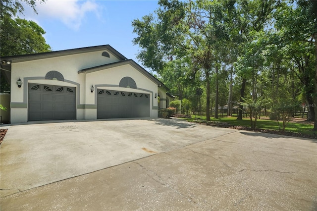 8518 Quail Hollow Blvd, Wesley Chapel, FL 33544 - view of front of house featuring concrete driveway, stucco siding, and a garage
