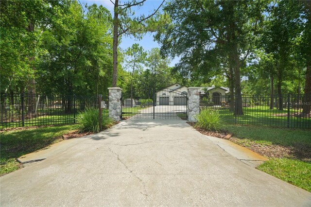 8518 Quail Hollow Blvd, Wesley Chapel, FL 33544 - view of concrete surface with a gated entry and a gate