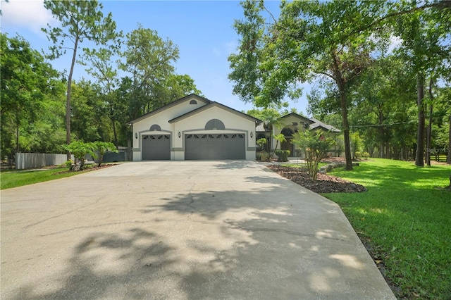 8518 Quail Hollow Blvd, Wesley Chapel, FL 33544 - ranch-style home with driveway, an attached garage, and stucco siding