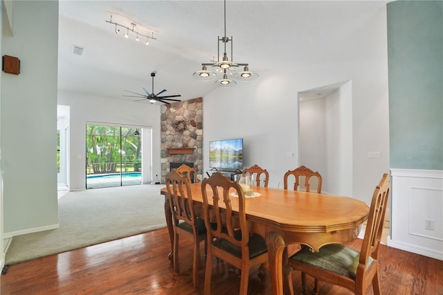 8518 Quail Hollow Blvd, Wesley Chapel, FL 33544 - dining area featuring a ceiling fan, vaulted ceiling, a fireplace, and wood finished floors