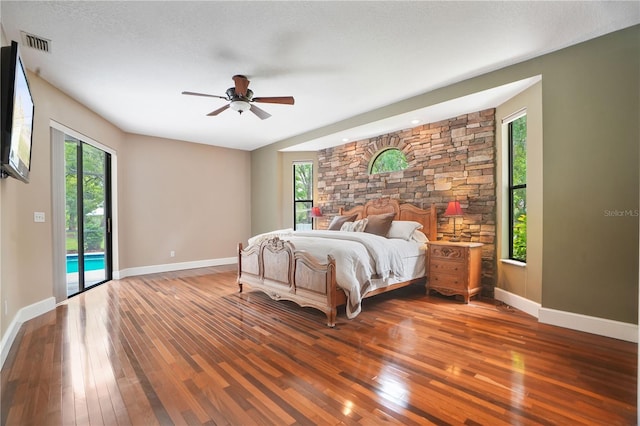 8518 Quail Hollow Blvd, Wesley Chapel, FL 33544 - bedroom with access to exterior, hardwood / wood-style flooring, and baseboards
