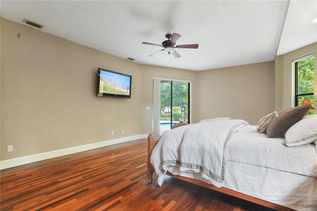 8518 Quail Hollow Blvd, Wesley Chapel, FL 33544 - bedroom with access to exterior, baseboards, wood finished floors, and ceiling fan