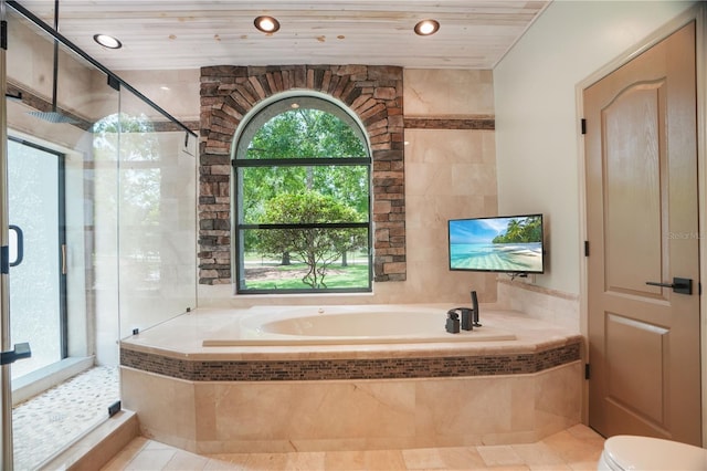 8518 Quail Hollow Blvd, Wesley Chapel, FL 33544 - bathroom featuring a bath, a stall shower, tile patterned flooring, toilet, and recessed lighting