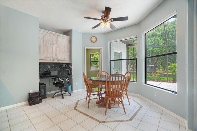 8518 Quail Hollow Blvd, Wesley Chapel, FL 33544 - dining room with plenty of natural light, light tile patterned floors, an office area, and baseboards