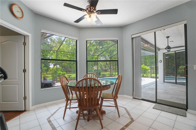 8518 Quail Hollow Blvd, Wesley Chapel, FL 33544 - dining space featuring ceiling fan, light tile patterned floors, and baseboards