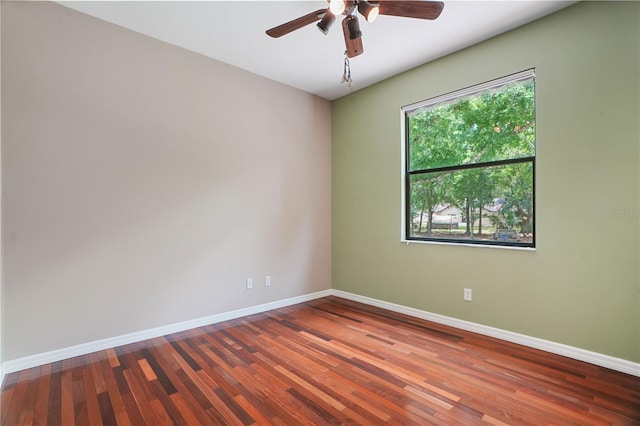 8518 Quail Hollow Blvd, Wesley Chapel, FL 33544 - empty room with baseboards, wood finished floors, and ceiling fan