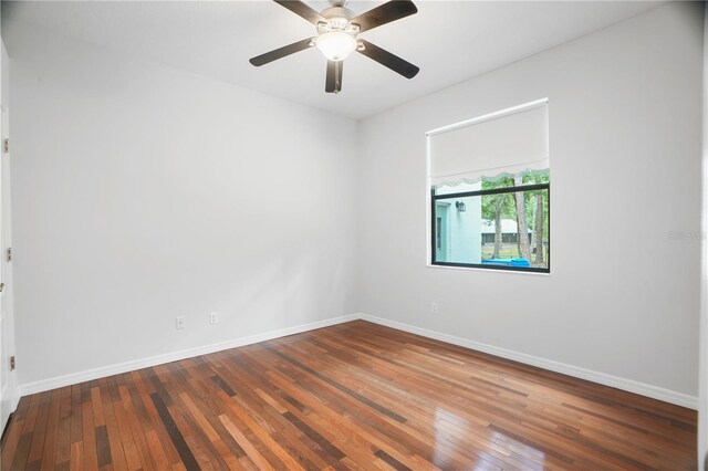 8518 Quail Hollow Blvd, Wesley Chapel, FL 33544 - unfurnished room featuring hardwood / wood-style flooring, baseboards, and a ceiling fan