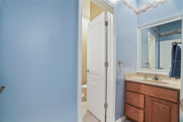 8518 Quail Hollow Blvd, Wesley Chapel, FL 33544 - bathroom with toilet, tile patterned floors, vanity, and baseboards