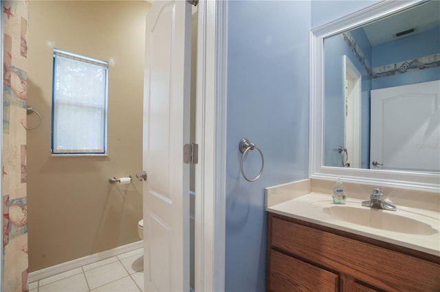 8518 Quail Hollow Blvd, Wesley Chapel, FL 33544 - full bathroom featuring toilet, vanity, tile patterned floors, and baseboards