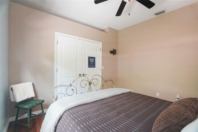 8518 Quail Hollow Blvd, Wesley Chapel, FL 33544 - bedroom featuring wood finished floors, a ceiling fan, baseboards, and a closet
