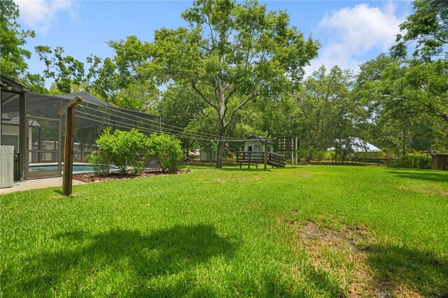 8518 Quail Hollow Blvd, Wesley Chapel, FL 33544 - view of yard featuring an outdoor pool and a lanai