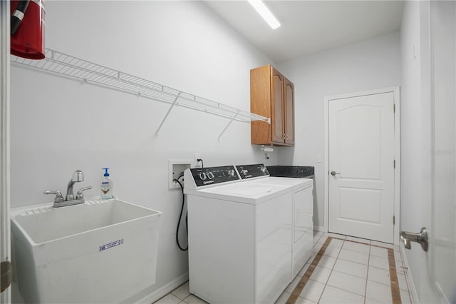 8518 Quail Hollow Blvd, Wesley Chapel, FL 33544 - laundry room with cabinet space, washing machine and dryer, light tile patterned floors, and baseboards