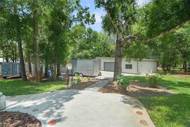8518 Quail Hollow Blvd, Wesley Chapel, FL 33544 - view of front of property with driveway, an outdoor structure, and a front lawn