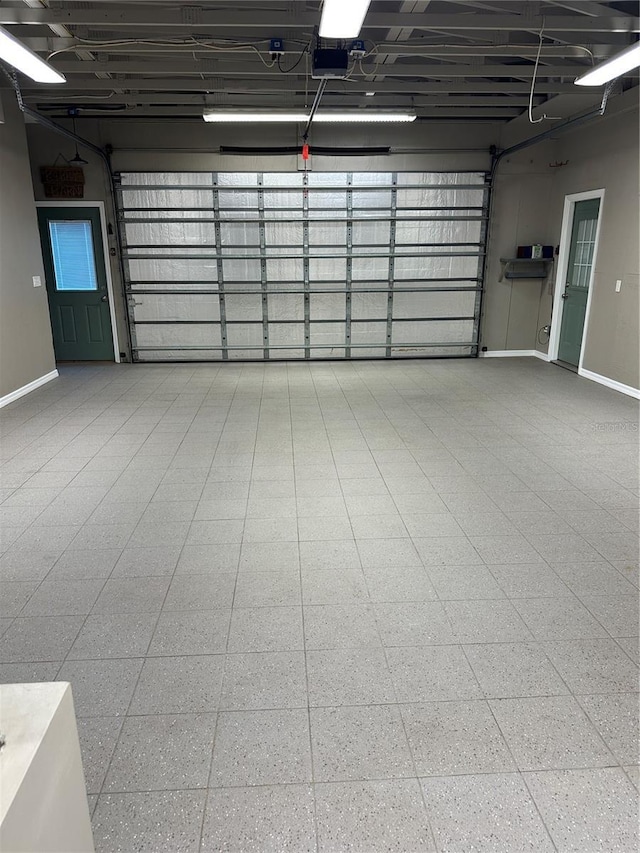 8518 Quail Hollow Blvd, Wesley Chapel, FL 33544 - garage with baseboards and a garage door opener