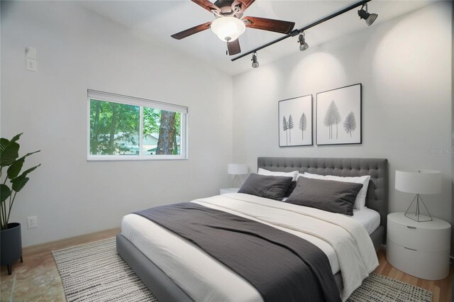 8518 Quail Hollow Blvd, Wesley Chapel, FL 33544 - bedroom featuring track lighting and light wood-style flooring