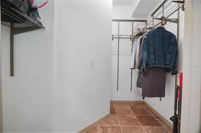 8518 Quail Hollow Blvd, Wesley Chapel, FL 33544 - spacious closet featuring stone tile floors