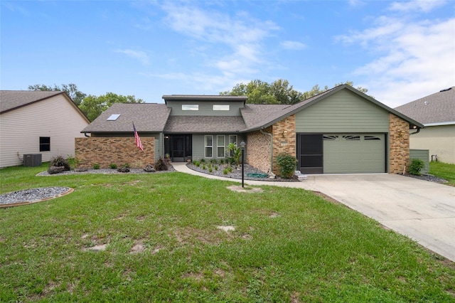 35046 Smoketree Ln, Dade City, FL 33523 - mid-century home with brick siding, driveway, a front yard, and a garage