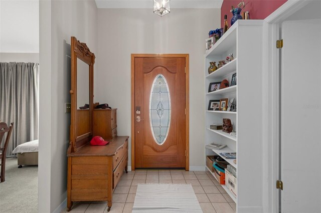 35046 Smoketree Ln, Dade City, FL 33523 - foyer entrance featuring light tile patterned floors and baseboards