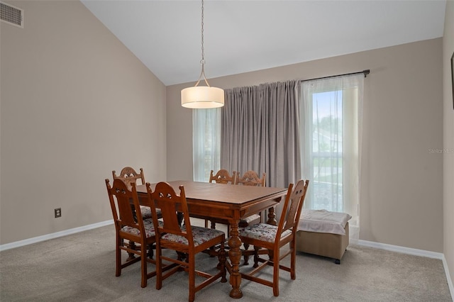 35046 Smoketree Ln, Dade City, FL 33523 - dining space featuring light colored carpet and lofted ceiling