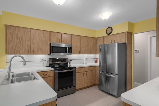 35046 Smoketree Ln, Dade City, FL 33523 - kitchen with stainless steel appliances, light countertops, tasteful backsplash, a textured ceiling, and light tile patterned flooring