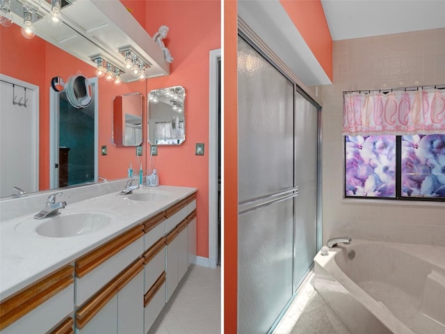 35046 Smoketree Ln, Dade City, FL 33523 - full bath with a shower stall, double vanity, a bath, and tile patterned floors
