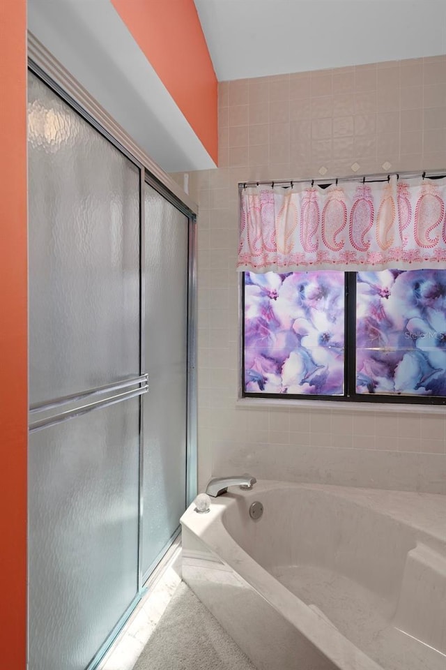 35046 Smoketree Ln, Dade City, FL 33523 - bathroom with a stall shower and a bath