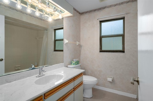 35046 Smoketree Ln, Dade City, FL 33523 - full bathroom featuring vanity, healthy amount of natural light, tile patterned floors, and a shower with curtain