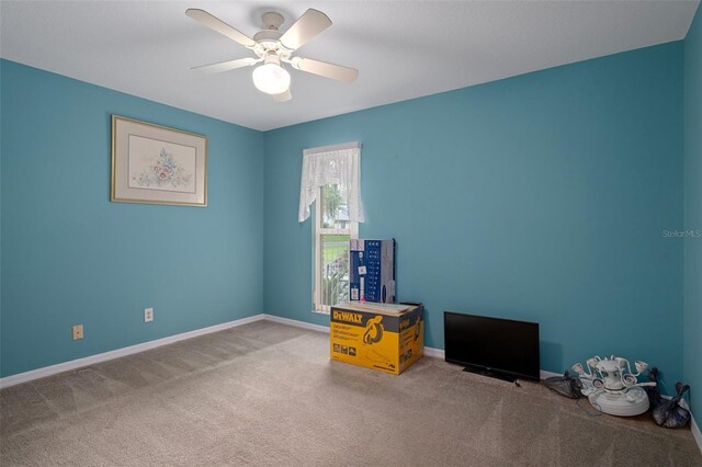 35046 Smoketree Ln, Dade City, FL 33523 - carpeted spare room with ceiling fan and baseboards