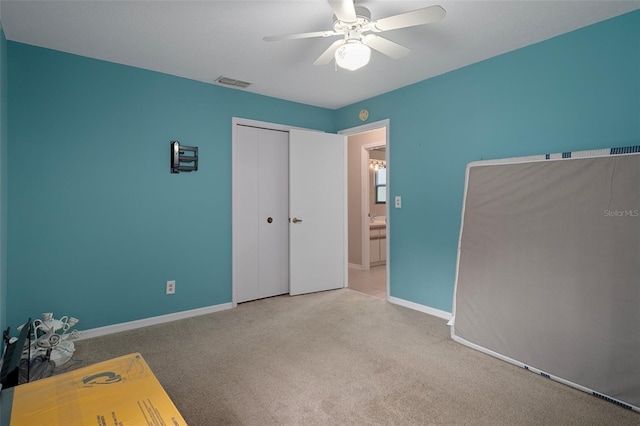 35046 Smoketree Ln, Dade City, FL 33523 - unfurnished bedroom with carpet floors, a closet, and a ceiling fan