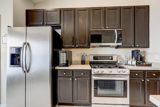 8335 Crescent Moon Dr, New Port Richey, FL 34655 - kitchen with stainless steel appliances, dark brown cabinets, and light countertops