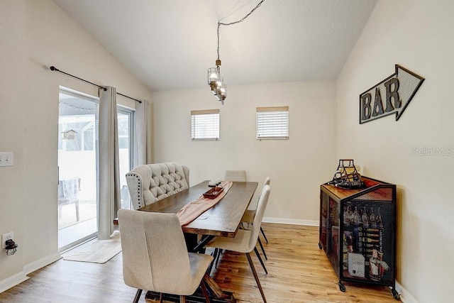 8335 Crescent Moon Dr, New Port Richey, FL 34655 - dining area featuring light wood-style floors and baseboards