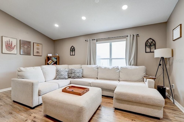 8335 Crescent Moon Dr, New Port Richey, FL 34655 - living area with recessed lighting, light wood finished floors, lofted ceiling, and baseboards