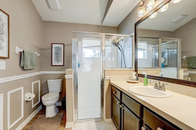 8335 Crescent Moon Dr, New Port Richey, FL 34655 - bathroom featuring toilet, vanity, and a shower stall