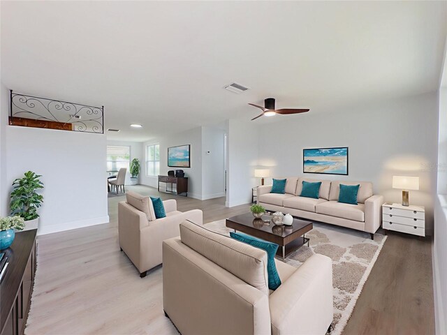 7608 Bougenville Dr, Port Richey, FL 34668 - living room featuring baseboards, light wood-style floors, ceiling fan, and recessed lighting