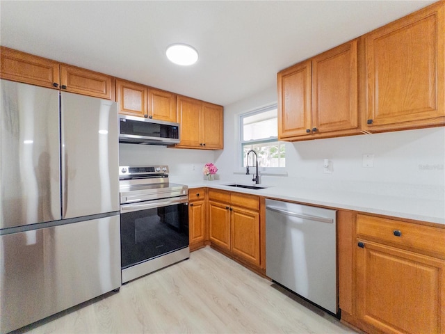 7608 Bougenville Dr, Port Richey, FL 34668 - kitchen with stainless steel appliances, a sink, light countertops, and brown cabinetry