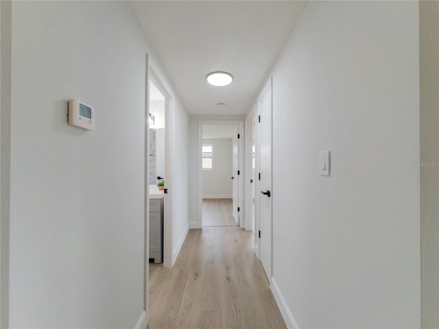 7608 Bougenville Dr, Port Richey, FL 34668 - hall featuring light wood-style flooring and baseboards