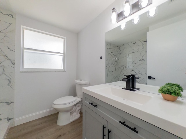 7608 Bougenville Dr, Port Richey, FL 34668 - bathroom with vanity, toilet, wood finished floors, and a marble finish shower