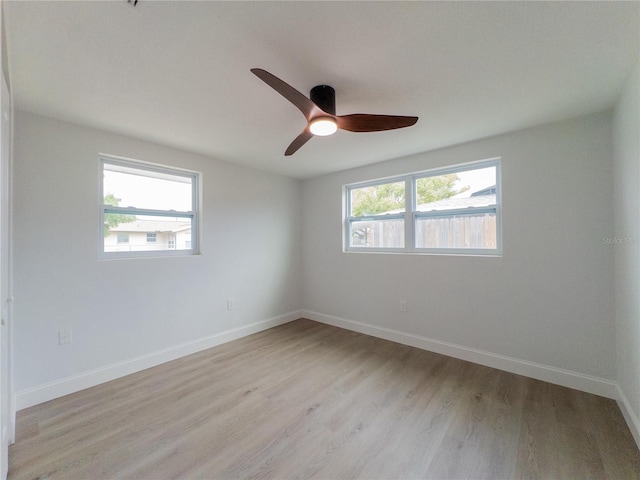 7608 Bougenville Dr, Port Richey, FL 34668 - spare room featuring light wood-type flooring, a ceiling fan, and baseboards