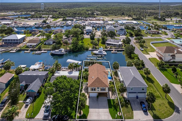 4460 Flounder Dr, Hernando Beach, FL 34607 - aerial view of residential area featuring property parcel outlined and a nearby body of water