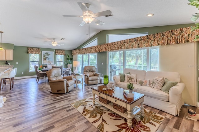 4460 Flounder Dr, Hernando Beach, FL 34607 - living area with a ceiling fan, light wood finished floors, vaulted ceiling, and recessed lighting