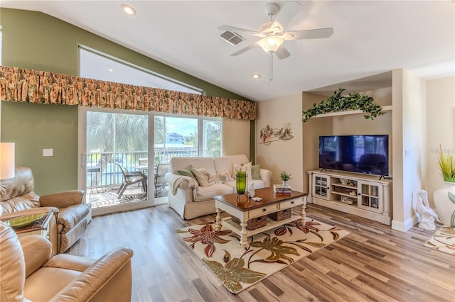 4460 Flounder Dr, Hernando Beach, FL 34607 - living room featuring vaulted ceiling, wood finished floors, ceiling fan, and recessed lighting