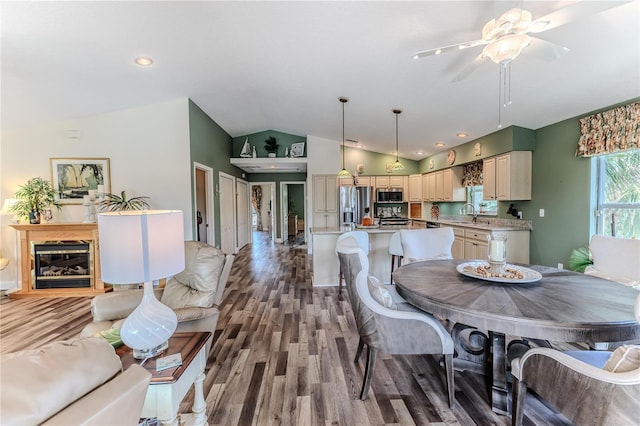 4460 Flounder Dr, Hernando Beach, FL 34607 - dining area with lofted ceiling, wood finished floors, and ceiling fan