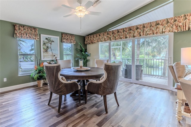 4460 Flounder Dr, Hernando Beach, FL 34607 - dining room with vaulted ceiling, wood finished floors, and ceiling fan
